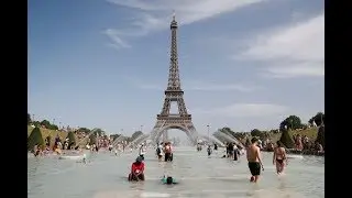 Public cool off near Eiffel Tower at peak heatwave 25JULY 2019