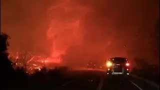 REDDING FIRE:  Firefighters in Redding battle flames whipped into a tornado-like vortex