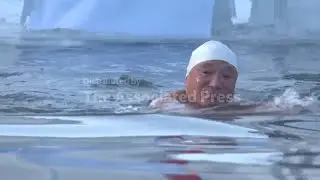 Older swimmers embrace numbing cold by plunging straight into ice water in China