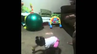 Kenleigh standing up by her self. Next she will be walking