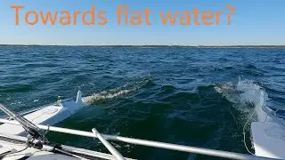 Catamaran sailing over shallow water in some waves #243