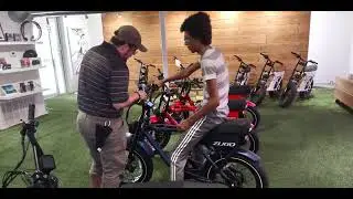 Me checking out the E-Bikes at Zugo Bike Store for the first time