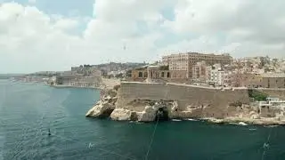 Famous Siege Bell War Memorial in Valletta, Malta capital City, Aerial Drone backwards, Revealing a