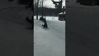 3 year old me wiping out my  snowmobile