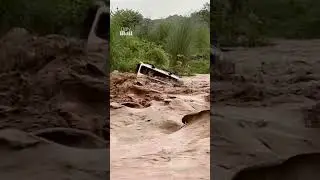 Dramatic moment Jeep swept away by floodwater in Northern India