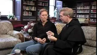 Rev. James McCurry, OFM of the Grey Friars giving me a lesson on the Rosary