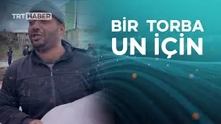 İsrail'in kıtlığa sürüklediği Gazze'de bir torba un alan Filistinli ağladı