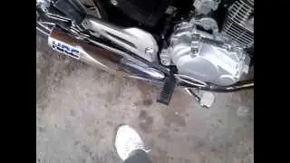 Titan 150 con escape HRC