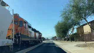 BNSF local train passes Grant St and goes street running through Phoenix along with 2617 leading 