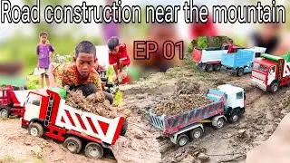 The contractor has formed the road near the mountain next to the river. EP 01 #excavotor #truck #car