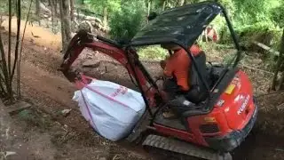 Dangerous job site conditions Excavator Machine on the edge of 45 degree bank