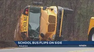 Wake Co. school bus flips going around curve in Raleigh
