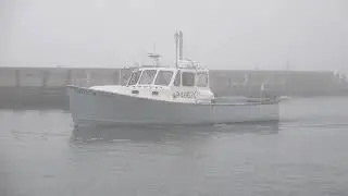 Foggy Falmouth Harbor, boat arrives