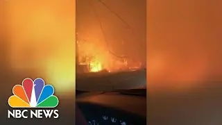 Watch A Father Calm His Daughter As They Drive Out Of Wildfire Range | NBC News
