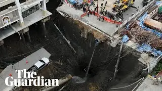 Sinkhole swallows part of street in front of Bangkok hospital