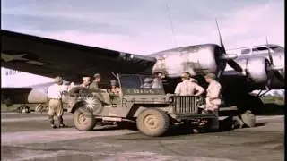 US officers talk to Japanese officers alongside the B-17 and enlisted men load ba...HD Stock Footage