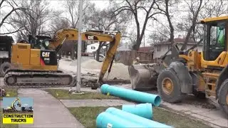 Stormwater Pipe Laying Crew With Excavator, Wheel Loader, and Skid Steer