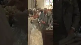 Bride walks down the aisle with her dad