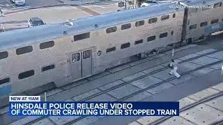 Woman crawls under stopped train in Hinsdale, video shows