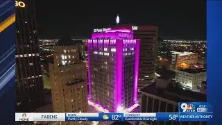 Blue Flame Building lights pink for Breast Cancer Awareness Month
