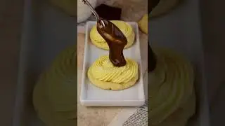 Boston Cream Cookies topped with pastry cream and chocolate glaze.