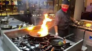 Radisson Blu Resort Maldives - Alifaan restaurant - steak grilling in open flame.