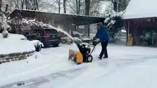 Winter Weather 2021 Cleaning snow in the yard during winter storm