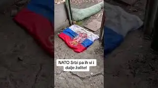 Ukrainian Heroes cleaning their shoes on Serbian Flag