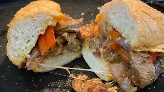 Philly cheese steak sandwich in a cast iron