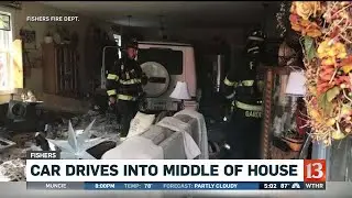 Car drives into middle of house