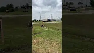 Blue Kenworth W900 growling hauling two containers