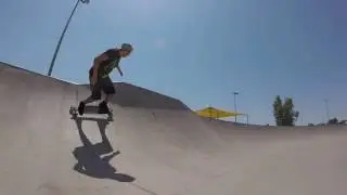 Carving a quarter pipe on a Sector 9 Longboard with a rolled ankle.