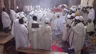 priests chanting at the gate of Saint Maryam church in Lalibela.