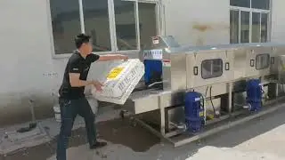 Plastic boxes chicken crates washing machine.