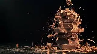 Super Slow Motion Fall of Grated Milk Chocolate on a Pyramid of Chocolate Slices