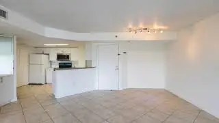 2-bedroom, 2-bathroom condo featuring open city views and two assigned parking spaces.
