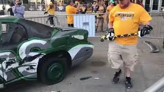 Smashville: Predators fans swing at the Stars car on the Bridgestone Arena plaza