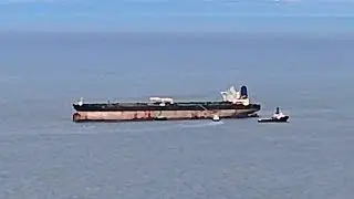 Drone footage shows captured Russian vessel anchored off the coast of Scotland | SWNS