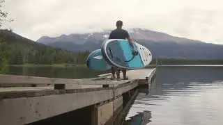 Paddle boarding at Dennis Lake Recreation Site near Smithers, BC. With camper van / RV.