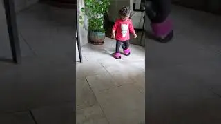 Toddler loves mom's slipper