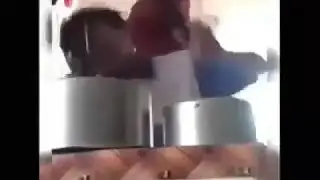 Guys gets hit in the head with a pan while singing