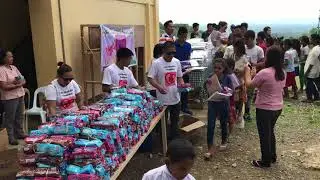 Giving school supplies and relief goods for indigenous people