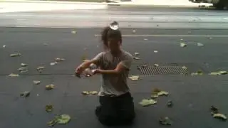 Contact juggling street performer in Melbourne, Australia