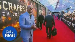 Dwayne Johnson arrives on the red carpet at Skyscraper premiere