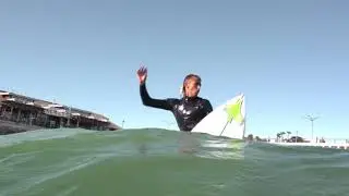 Surfing the Redondo Horseshoe Pier. By Greg Browning
