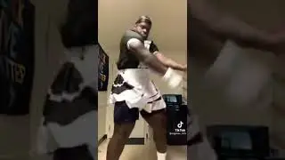 Black man in maid dress dancing