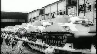 Workers work on tanks in assembly line,and tanks being taken to battlefield in ra...HD Stock Footage