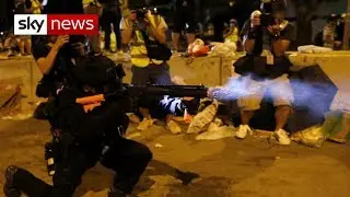 Hong Kong police rush at protesters