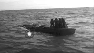 Coastguardsmen rescued from sinking Higgins boat during D-Day landings on Omaha B...HD Stock Footage