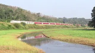 Red LHB Kerala super fast & Green ICF Garib rath cruising through Kanjiramattam
